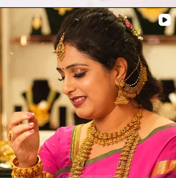 A bride in pink at the counter, the display cases behind her